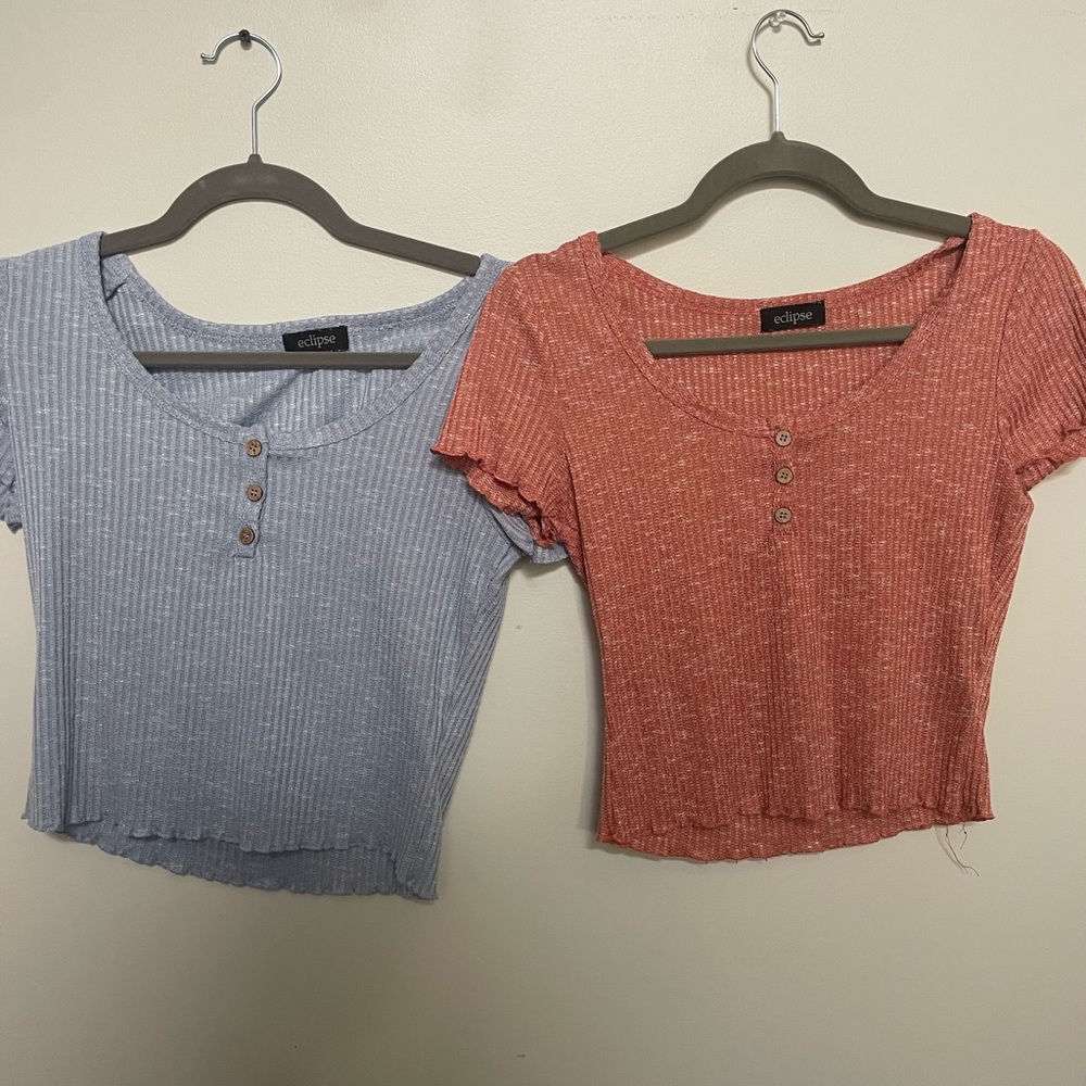 Two blue and orange tops